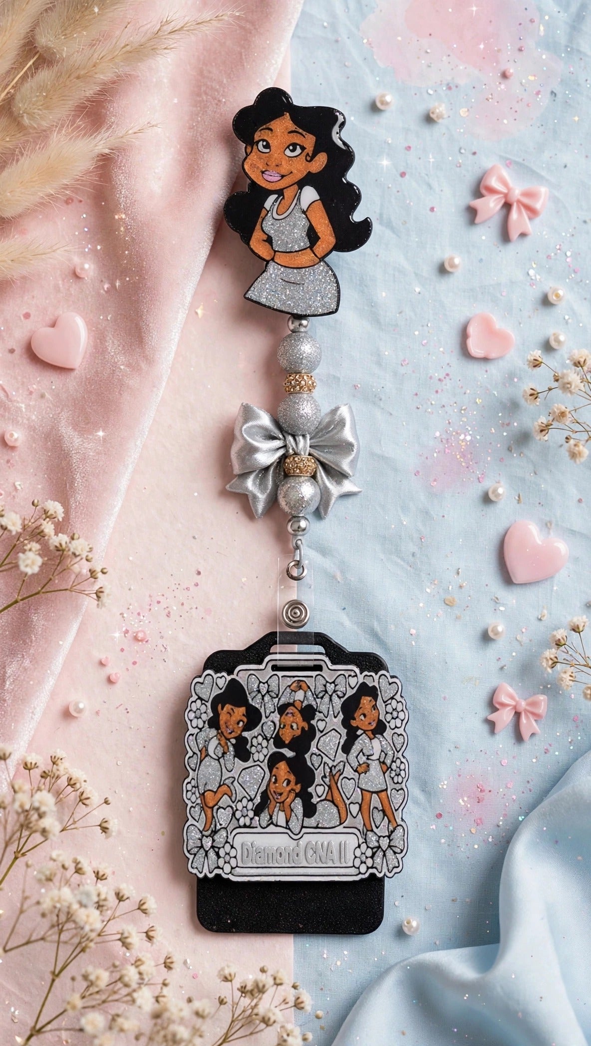 Penny Badge Reel Set in Silver β badge reel, beaded dangle with bow, and personalized badge buddy, styled on blush pink and baby blue