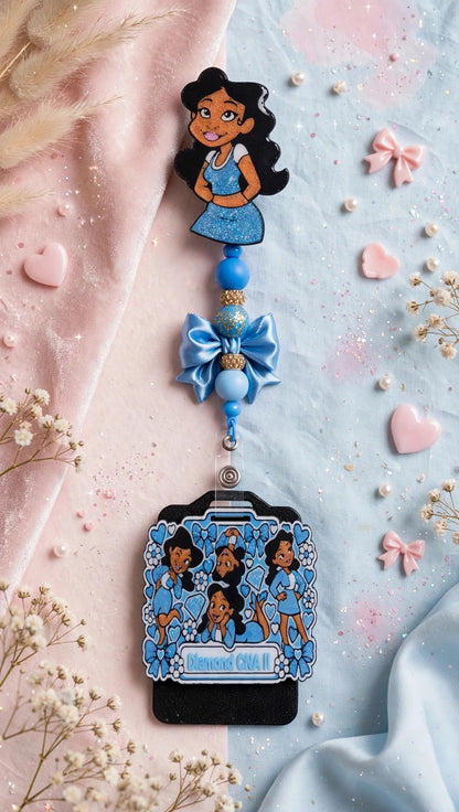 Penny Badge Reel Set in Blue — badge reel, beaded dangle with bow, and personalized badge buddy, styled on blush pink and baby blue