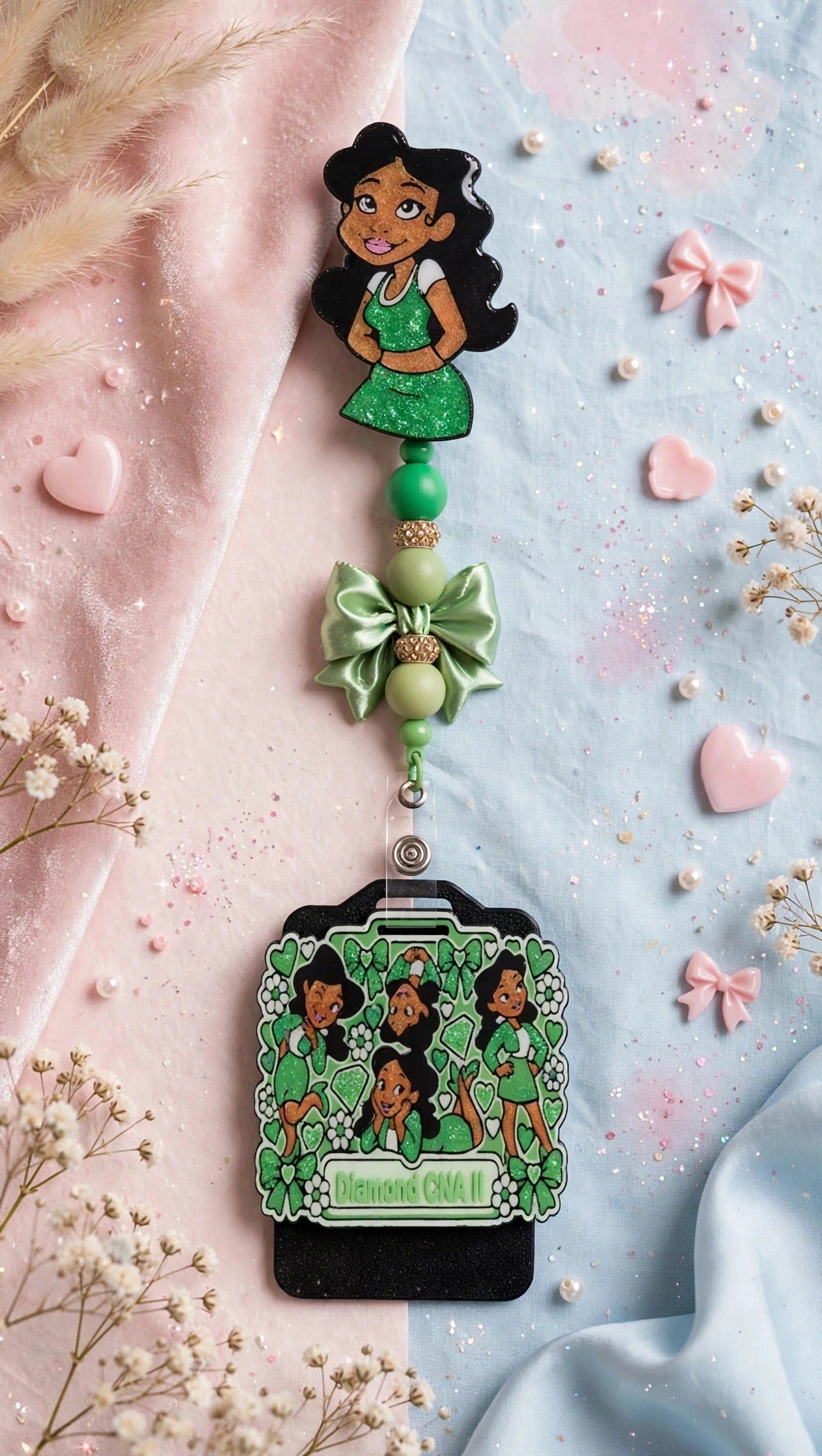 Penny Badge Reel Set in Green — badge reel, beaded dangle with bow, and personalized badge buddy, styled on blush pink and baby blue