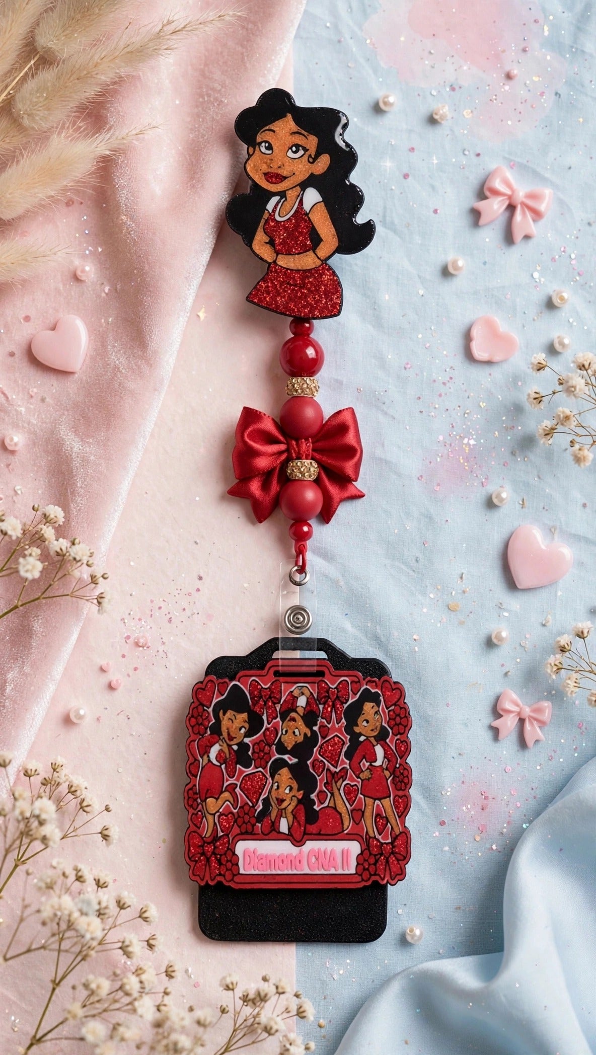 Penny Badge Reel Set in Red — badge reel, beaded dangle with bow, and personalized badge buddy, styled on blush pink and baby blue
