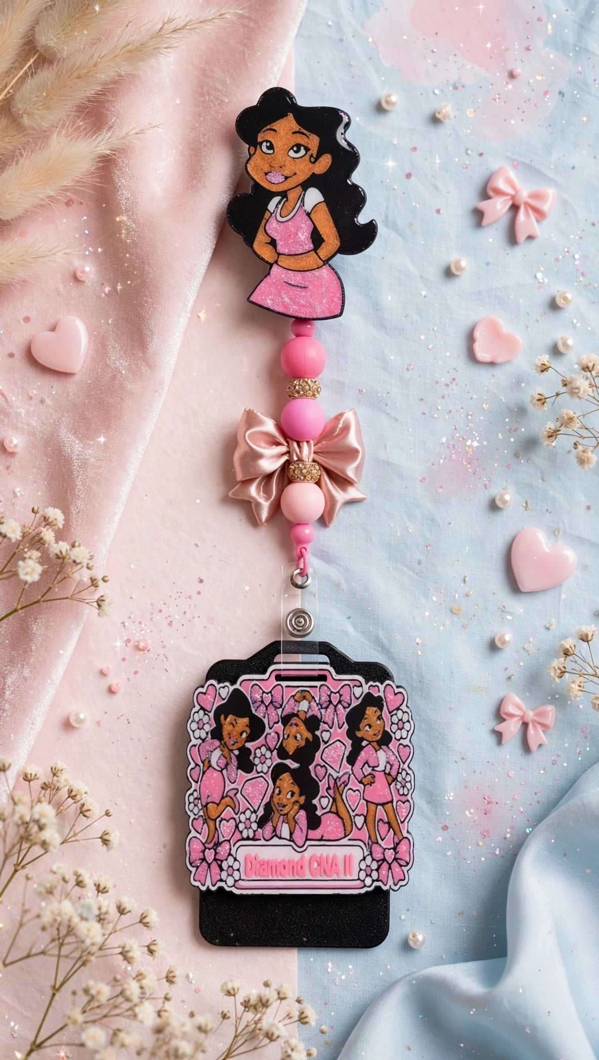 Penny Badge Reel Set in Pink — badge reel, beaded dangle with bow, and personalized badge buddy, styled on blush pink and baby blue
